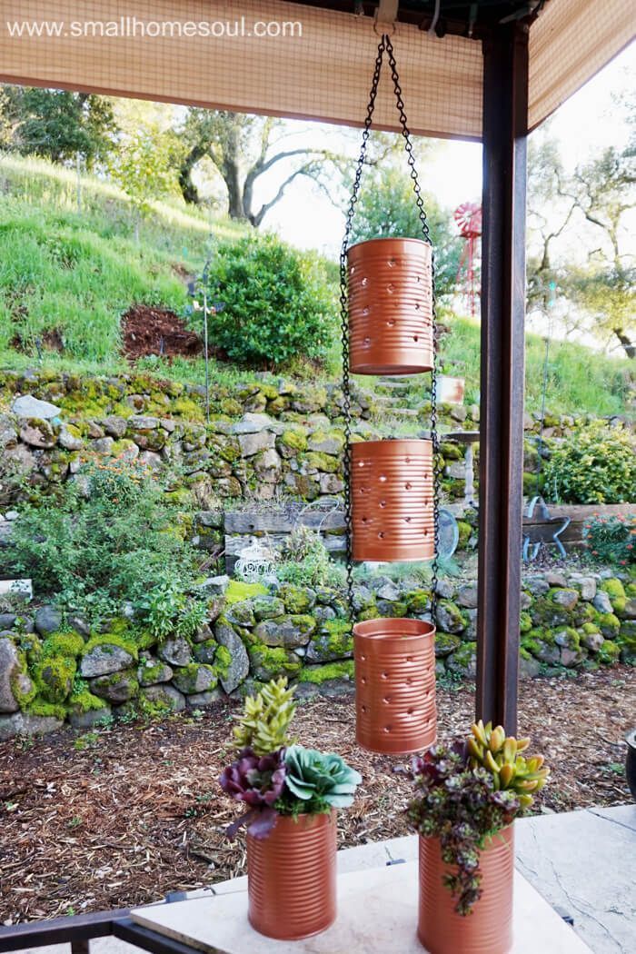 Making a recycled tin can lantern and planter is a great way to reduce, reuse, a...