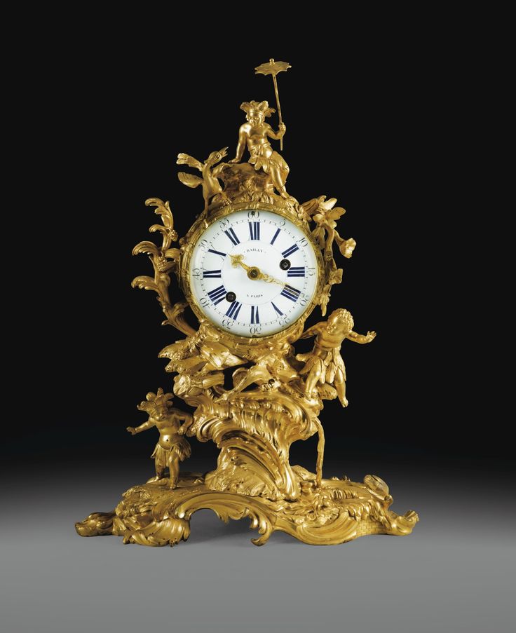 Rare pendule aux sauvages en bronze doré d'époque Louis XV, la caisse sign...