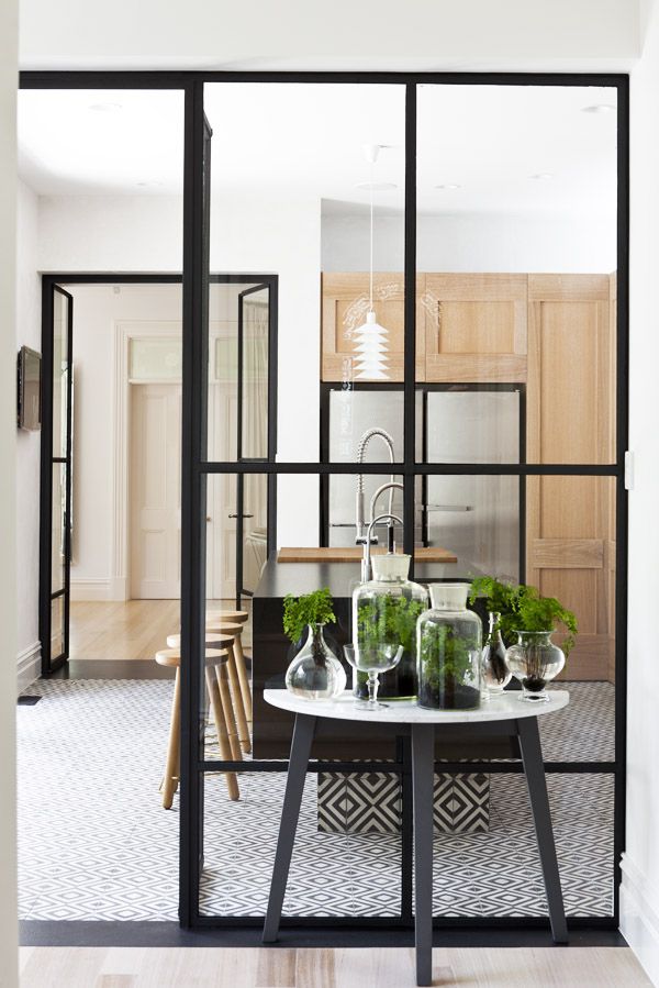 THE GLASS DIVIDE: A SELECTION OF KITCHENS BEHIND GLASS