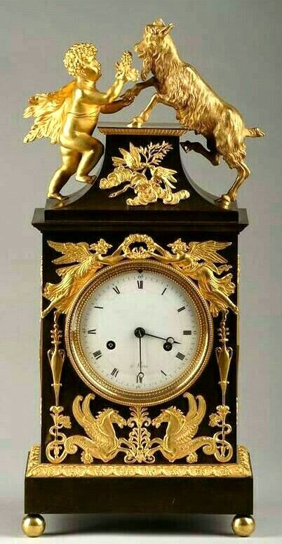 Reloj magnifico dorado y negro, figurativo de la chimenea #relojes #michaelkors ...