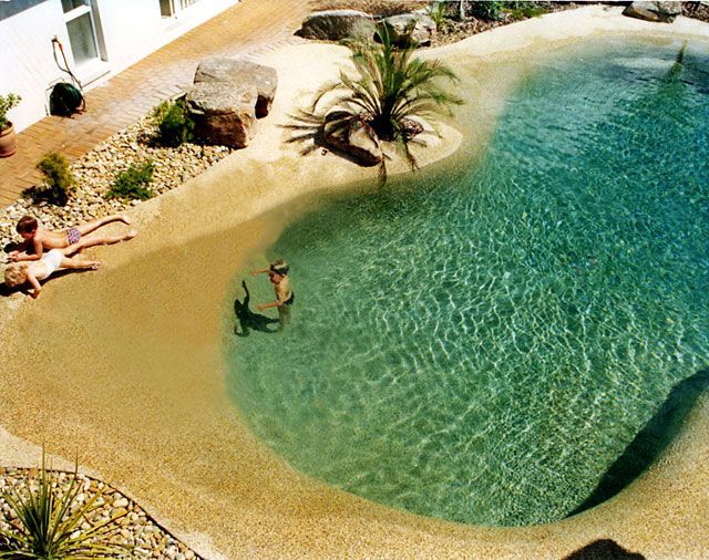 My dream swimming pool - Looks like the beach! Notice what looks like a shark pa...