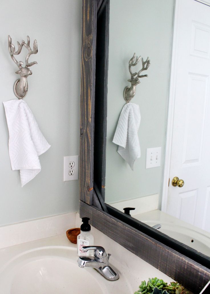 customize your bathroom mirror with a rustic wood frame!