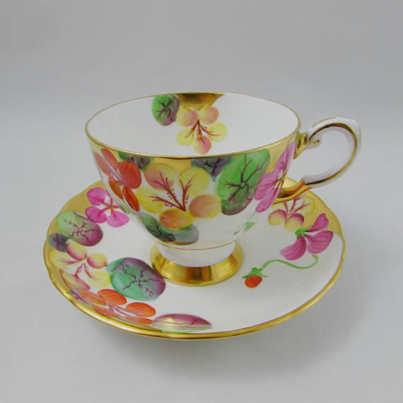 Vintage English bone china tea cup and saucer made by Tuscan. Tea cup and saucer...