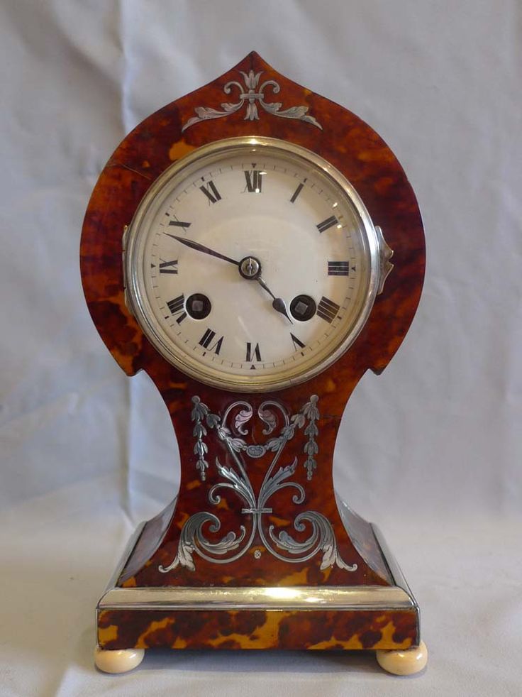 Antique tortoiseshell mantel clock with silver inlay and stringing and ivory fee...