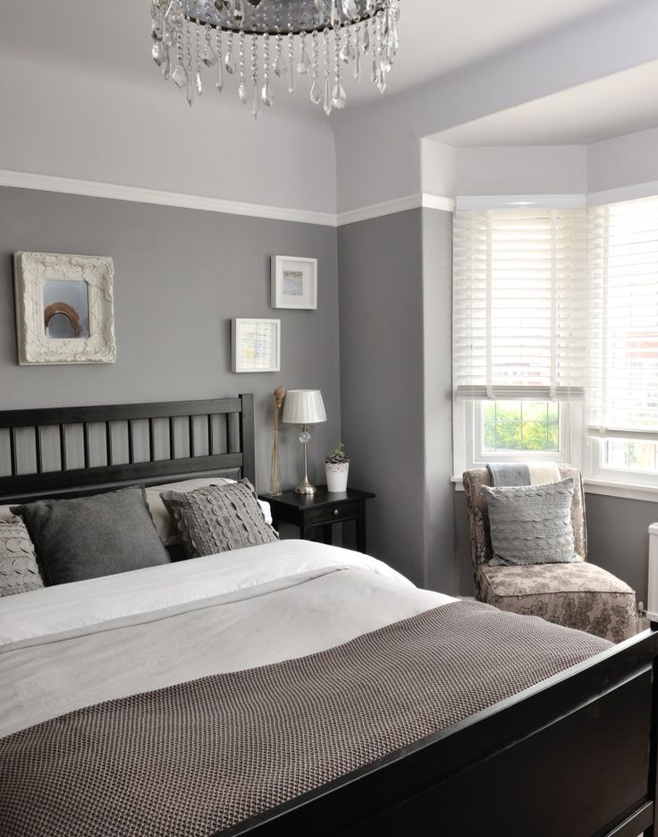 Different tones of grey give this bedroom a unique and interesting look. Continu...