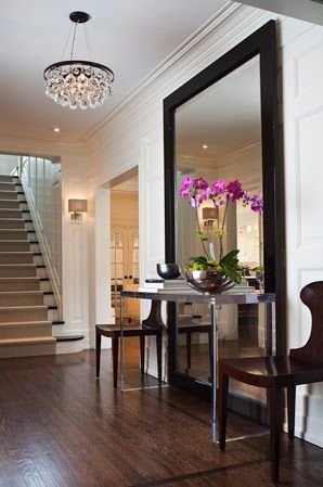 Love the wall to ceiling mirror with table in front. Perfect for a foyer