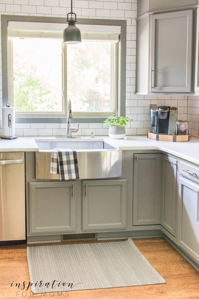 simple summer kitchen decor with farmhouse sink and gray cabinets subway tile