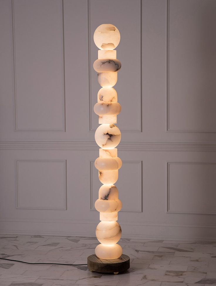 Allied Maker reveals a series of three large totem luminaires in stone, glass, ...