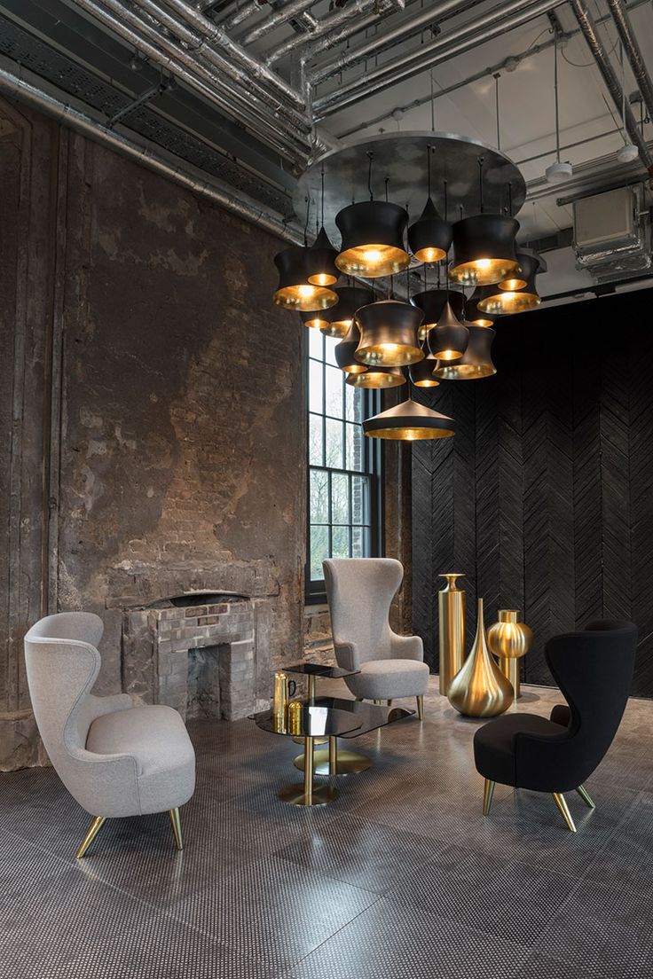Beat lighting pendants by Tom Dixon inside his new industrial office and shop