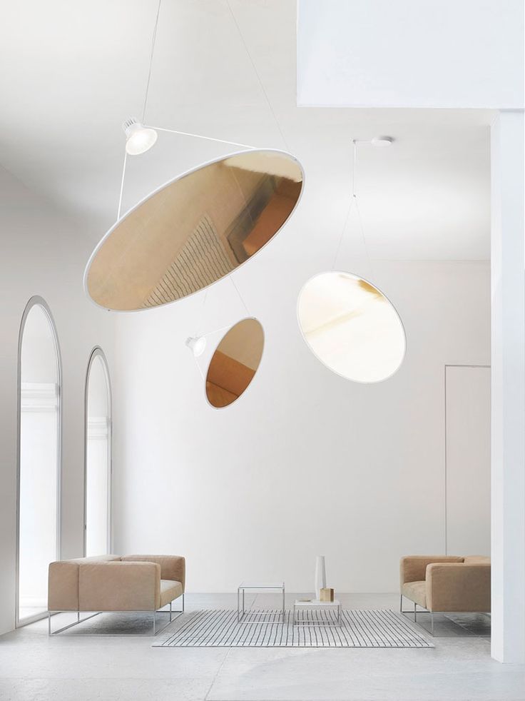 The circular aluminum Amisol light by Daniel Rybakken for Luceplan