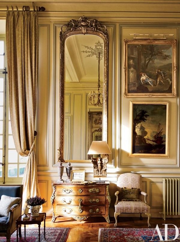A Régence commode and Louis XIV armchair grace the same space | archdigest.com