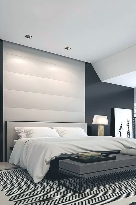 master bedroom with black walls, and black and white rug