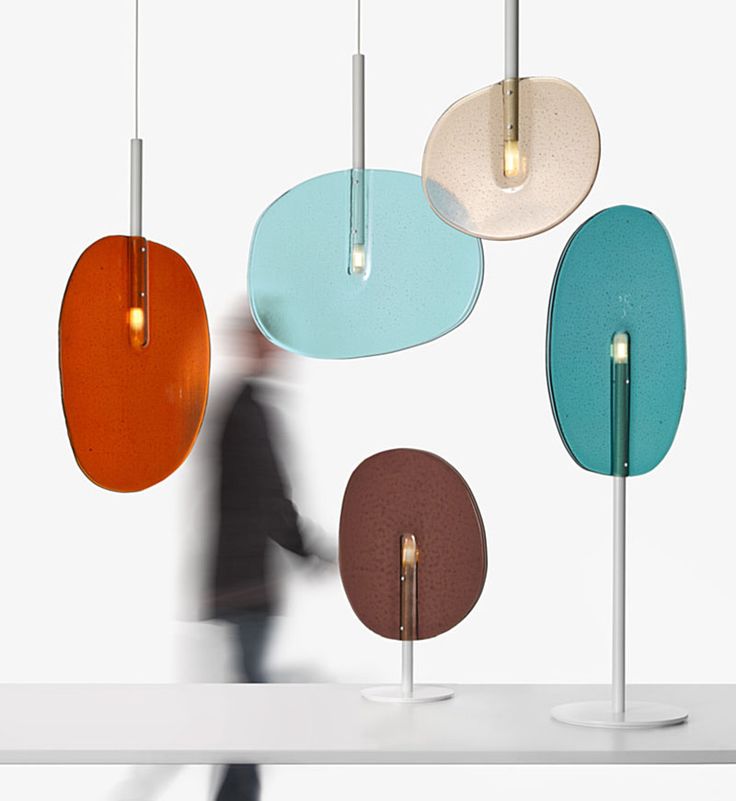 The Lollipop Collection, made up of a floor lamp, table lamp and pendant lamps, ...