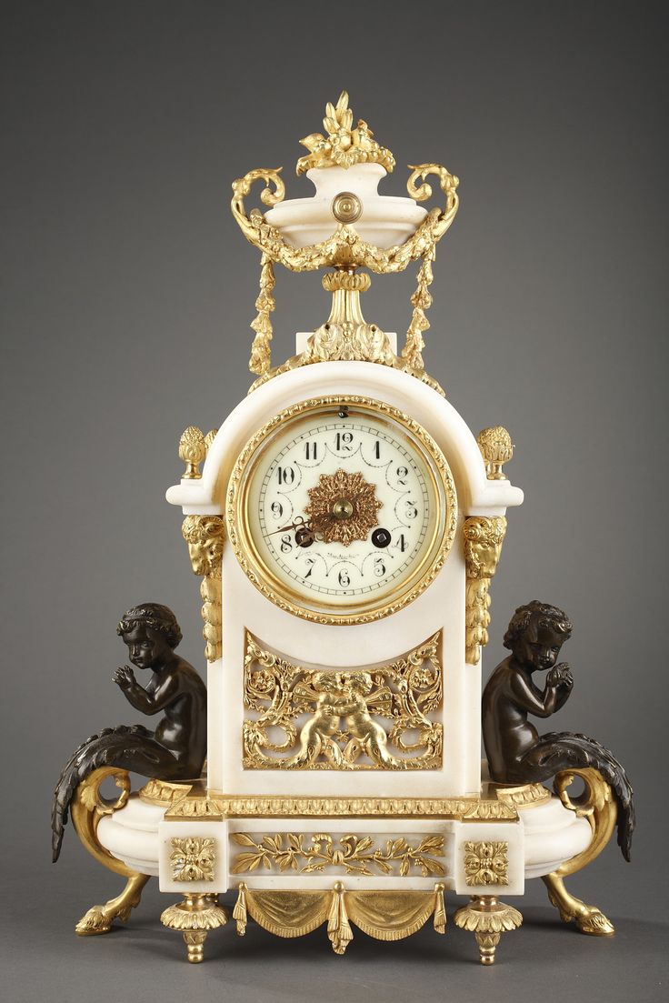 A very beautiful Louis XVI style mantel clock in marble with rich gilt bronze de...
