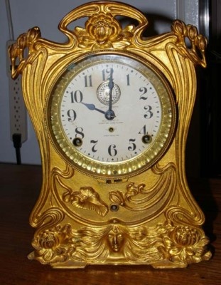Art Nouveau 8 day Seth Thomas cast iron alarm clock.