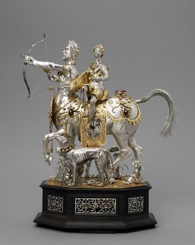 This outstanding example of Augsburg gold work combines the function of a clock ...