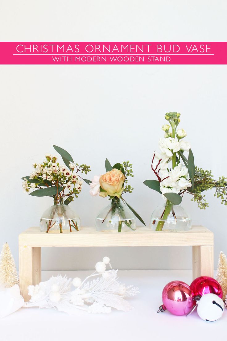 Create this wooden base and turn christmas ornaments into bud vases with this DI...