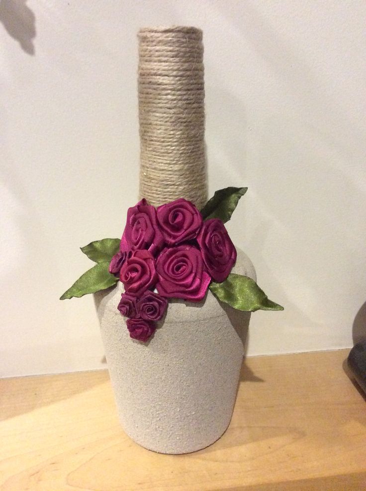 Made from my favourite, a Tia Maria bottle, using textured spray paint, twine an...