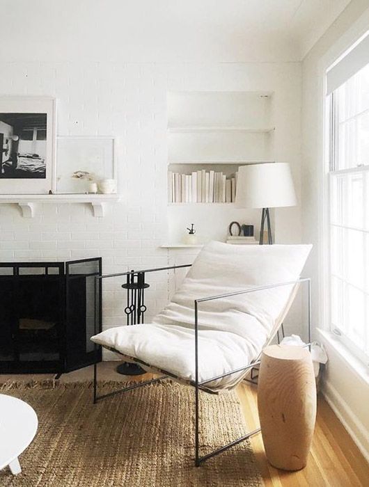 simple white living room with black and wood details. / sfgirlbybay