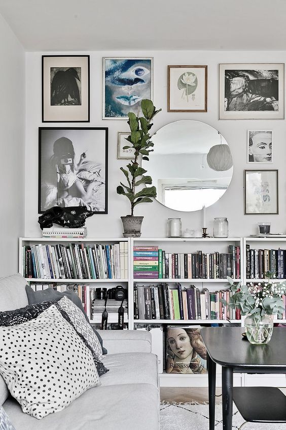 Modern Scandinavian grey living room with wall art and green plants