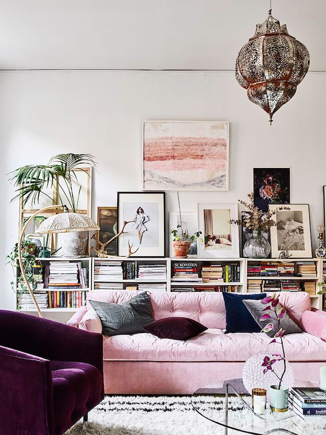Pink sofa and velvet armchair in the beautiful Stockholm home of Amelia Widell -...