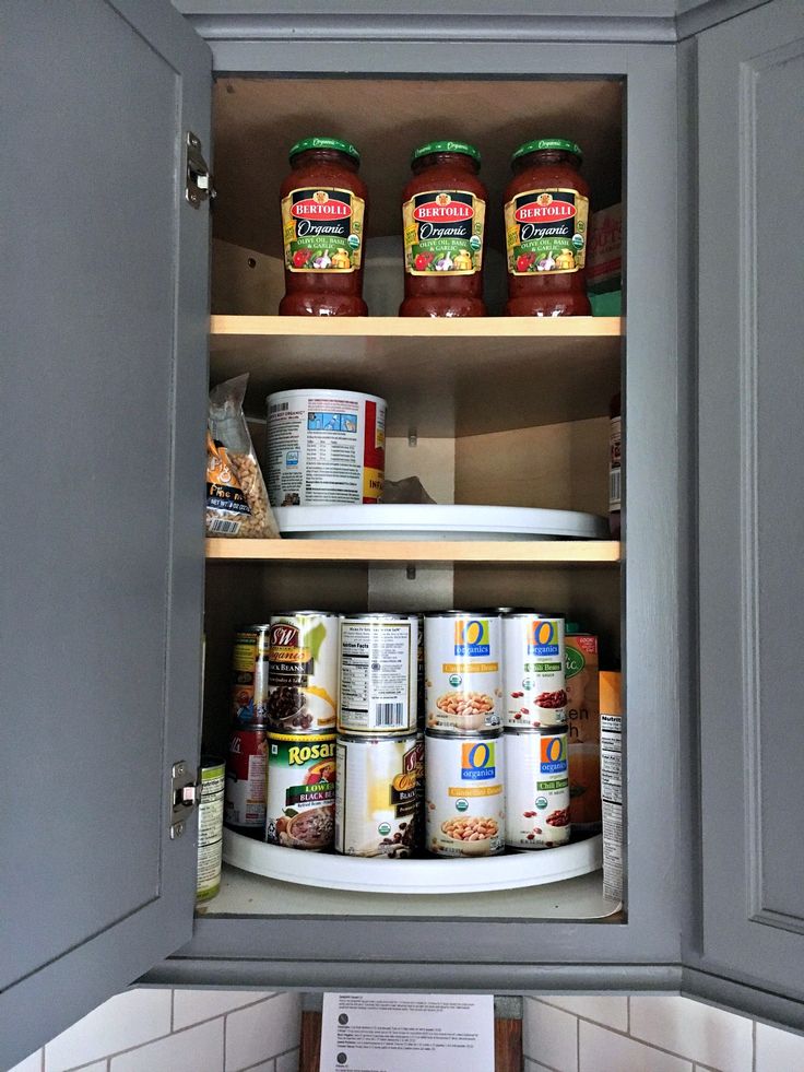 organize kitchen with lazy susans for canned goods
