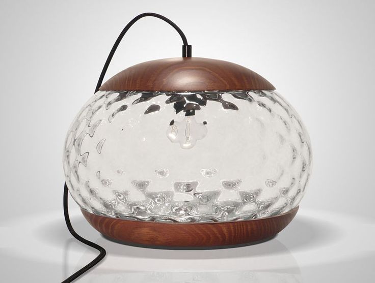 Mariana Costa e Silva has designed the Jar Lamp, a simple glass and wood table l...