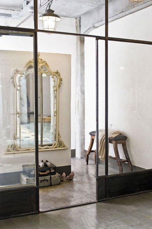 Contrast is everything: delicate gold mirror in old industrial building. Love th...
