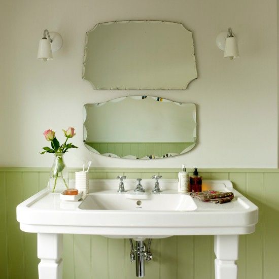 Green vintage bathroom. Vintage mirrors and retro wall lights around this period...