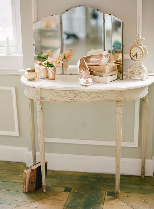 Use a half moon console table as a dressing table for use in smaller rooms!