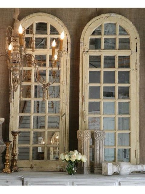 Old window frames repurposed over mirrors.