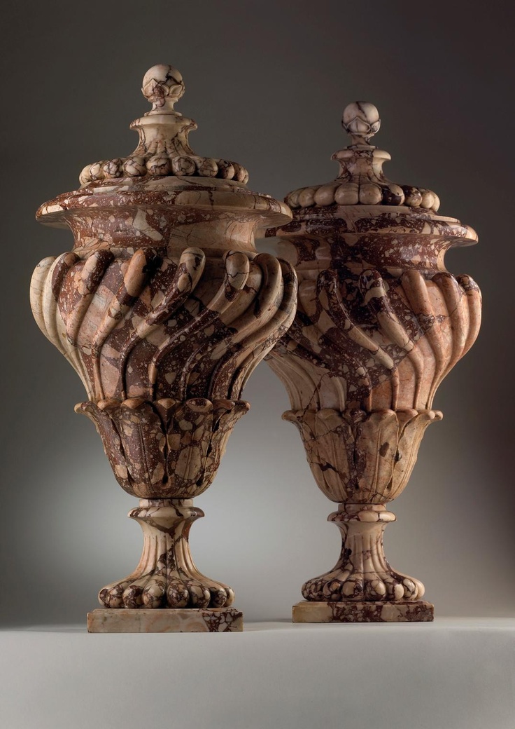 *ROMAN, 18th Century. A pair of breccia Corralina vases and covers.