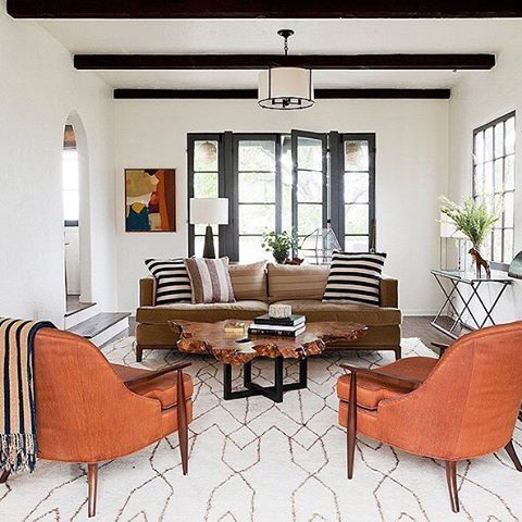 This desert modern living room is !! Pair a few mid-century leather pieces with ...