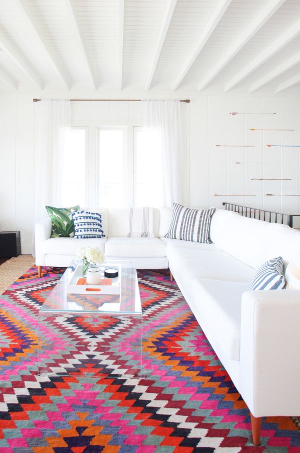 colorful and graphic rug in all white living room