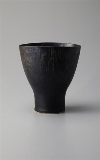 Flower vase, Stoneware, manganese glaze, sgraffito design inside and out. The we...