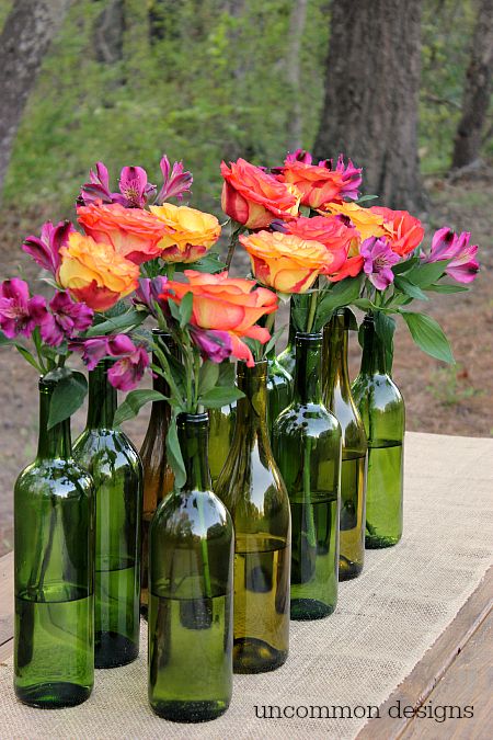 Make an Easy and Elegant Floral Centerpiece out of Wine Bottles! Perfect for wed...