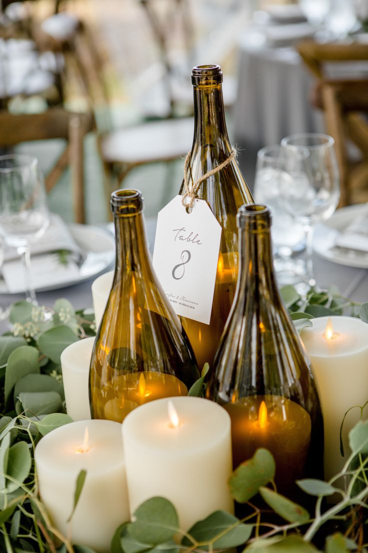 Wine bottle candle lanterns: Catering: The Oyster Girls - www.stylemepretty... C...