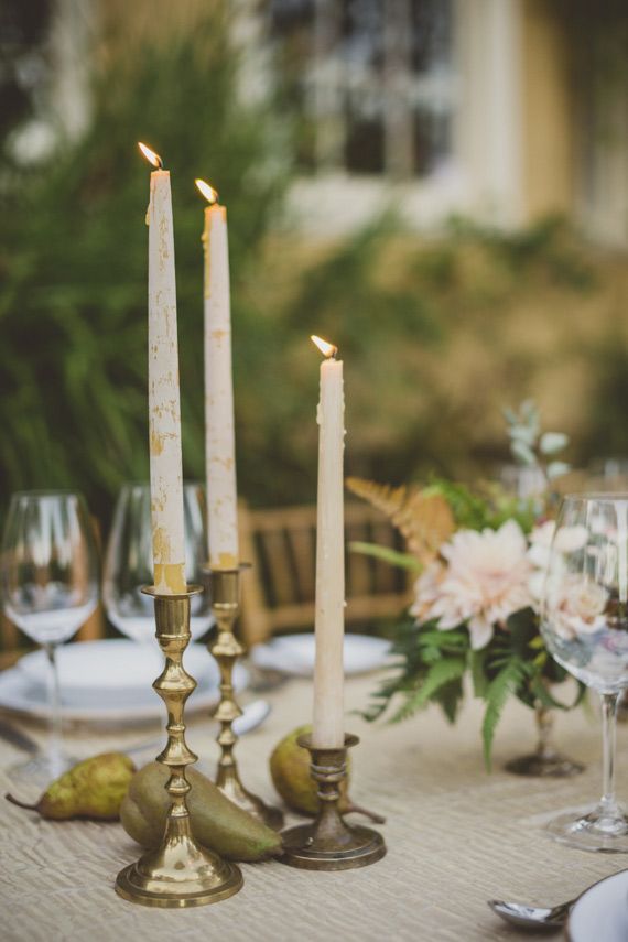 As much as we love votive candles on tabletops, these brushed white & gold candl...