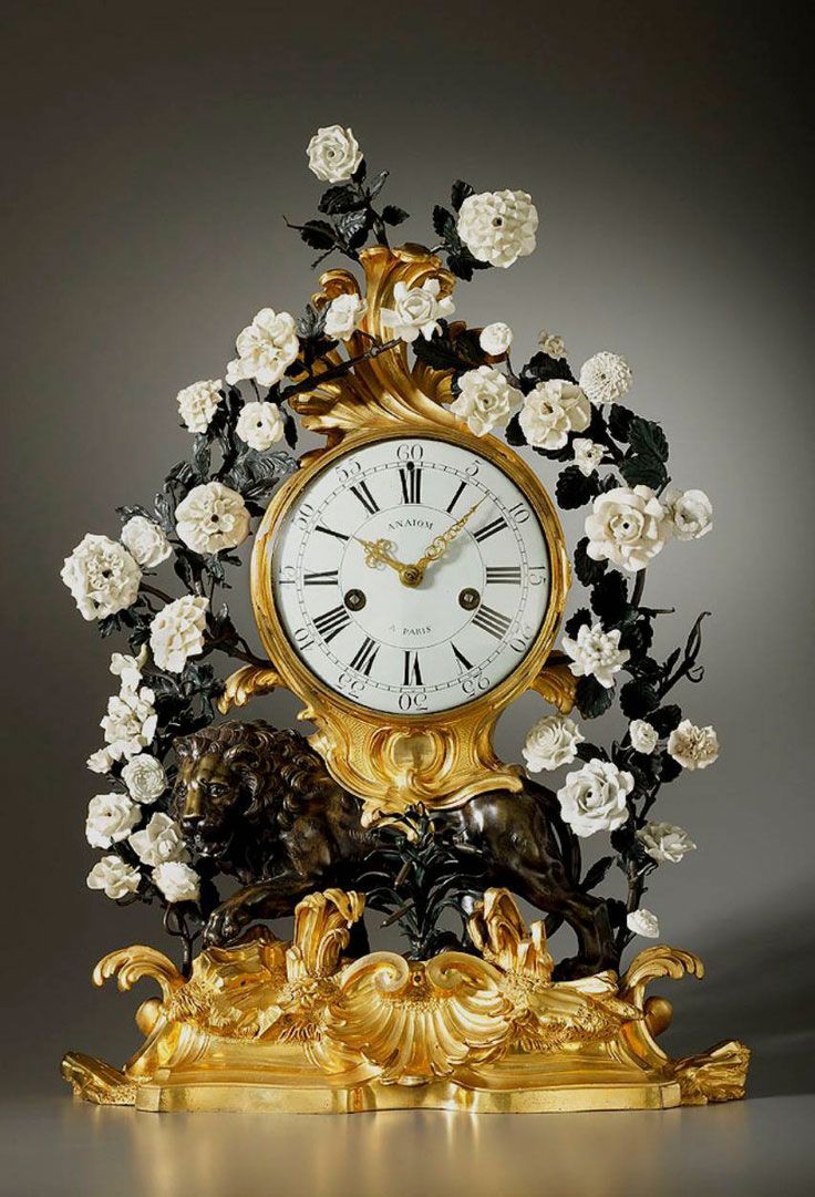Antique clock French ca 1800. Beautiful mantel clock in gilded bronze with white...