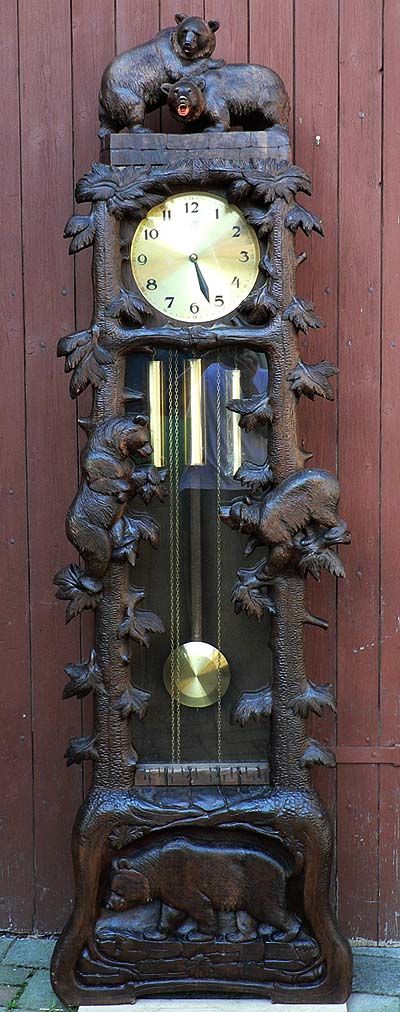 a carved wood grandfather clock with bears, swiss 1930s.