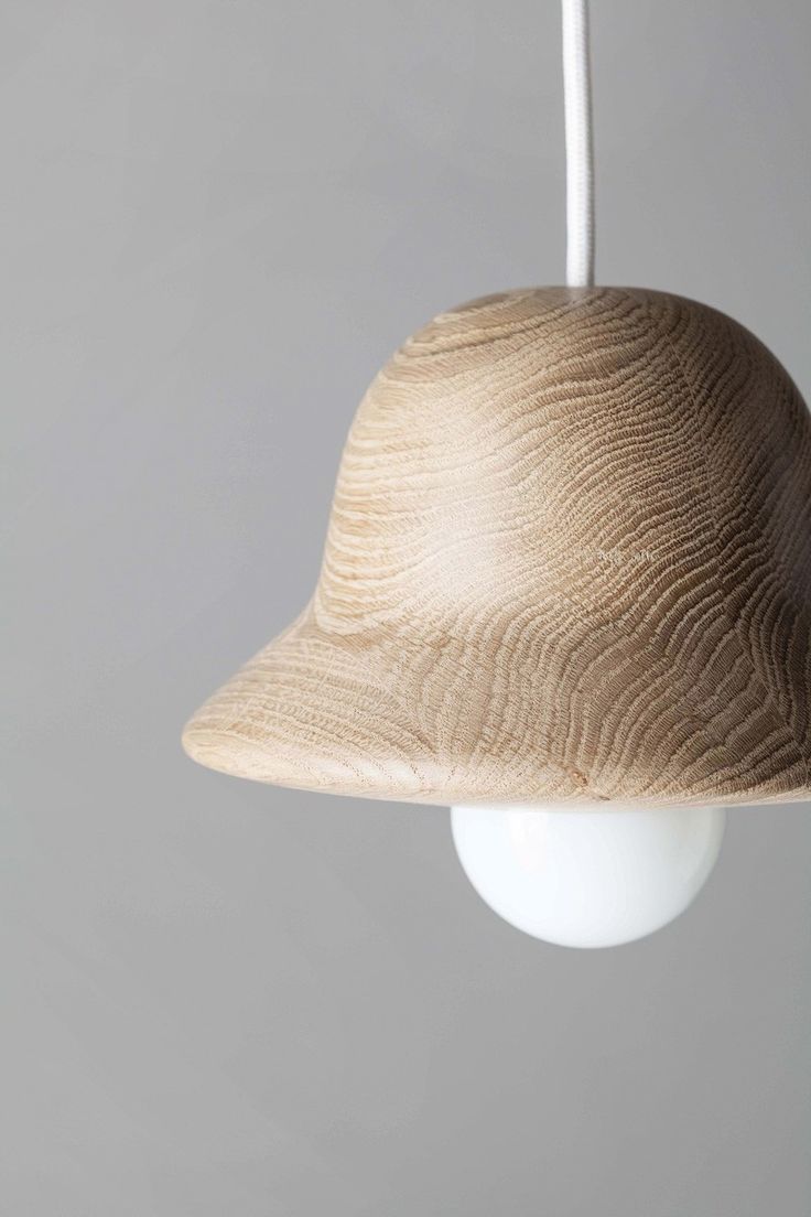 Norm Architects have designed HAT, a pendant lamp made from wood, that was inspi...