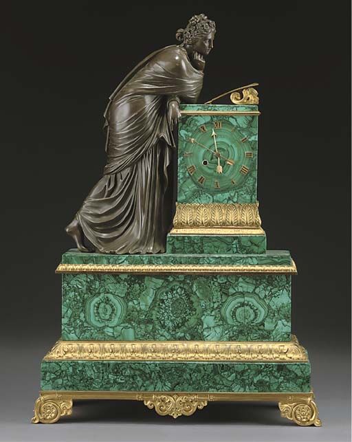A FRENCH GILT BRONZE AND MALACHITE VENEERED MANTEL CLOCK MID 19TH CENTURY The st...