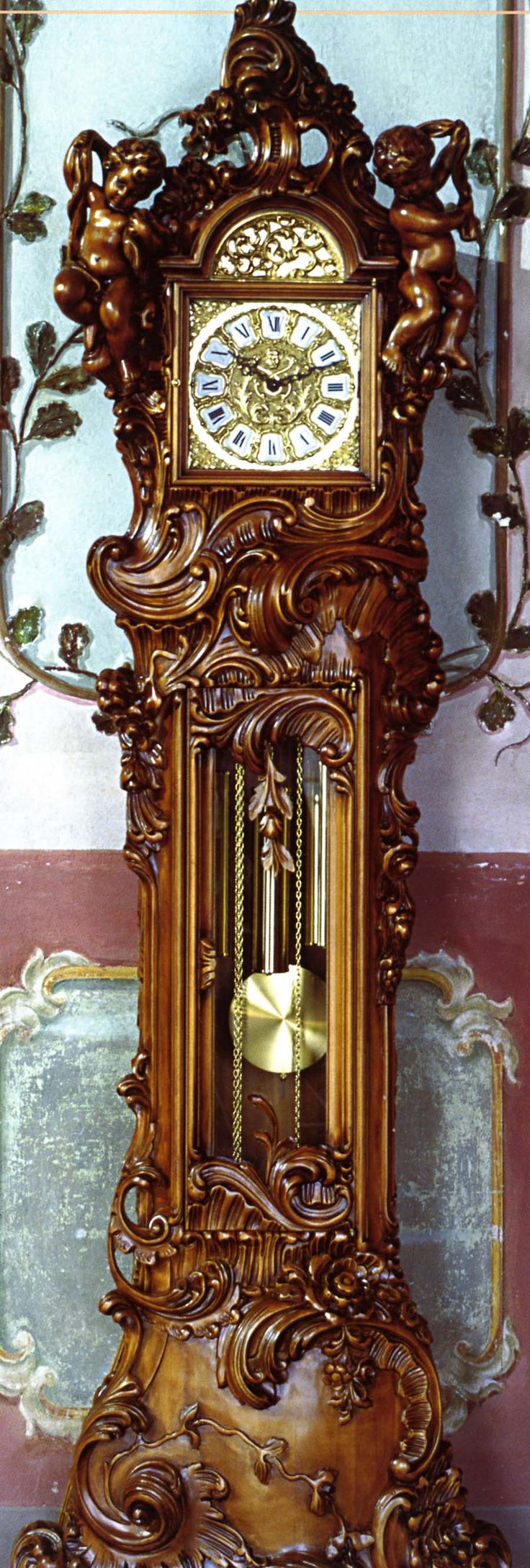 Ornately carved Le Ore grandfather clock. (Italian)