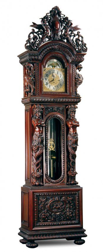 Carved mahogany clock, after R.J. Horner