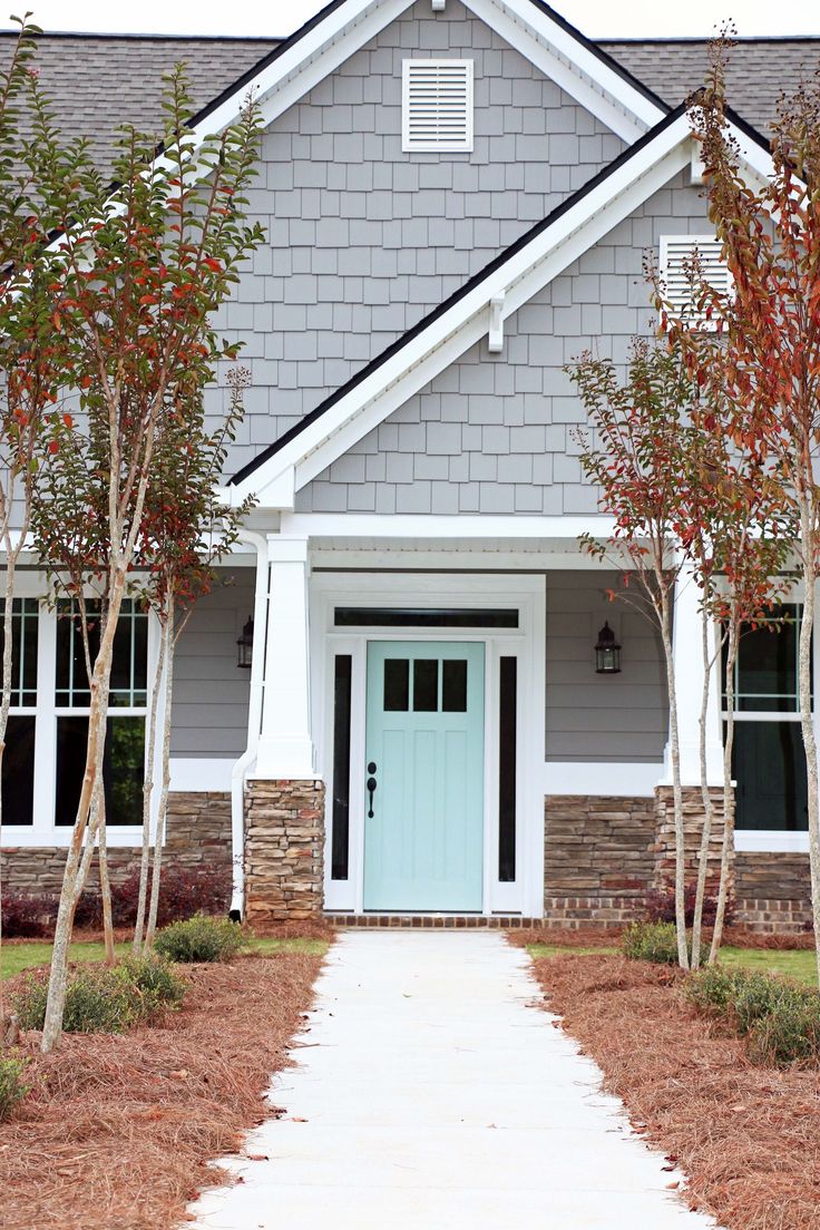 Door: Waterscape by Sherwin-Williams; Siding: Dovetail by Sherwin-Williams