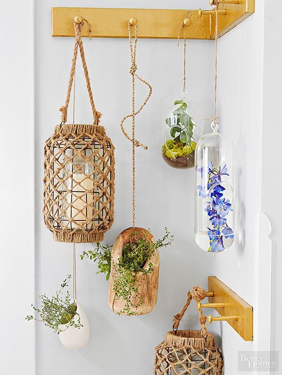 Hanging lanterns and indoor shrubs redefine a coat rack (and garden, too!).