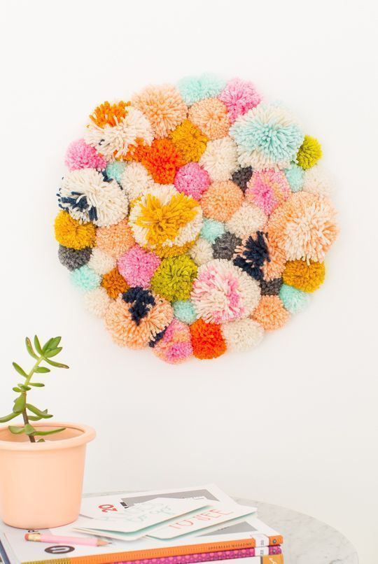 DIY Pom Pom Wall Hanging for any decor style.  Create your very own color palett...