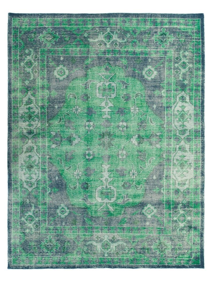 Brilliant emerald and sturdy grey combine to create a wordly rug, regal and yet ...