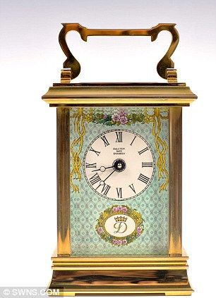 A fine Royal presentation carriage clock, by Halcyon Days Enamels is on offer to...
