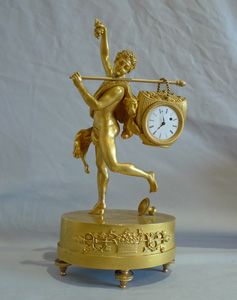 Miniature French Empire antique ormolu mantel clock of Bacchante.